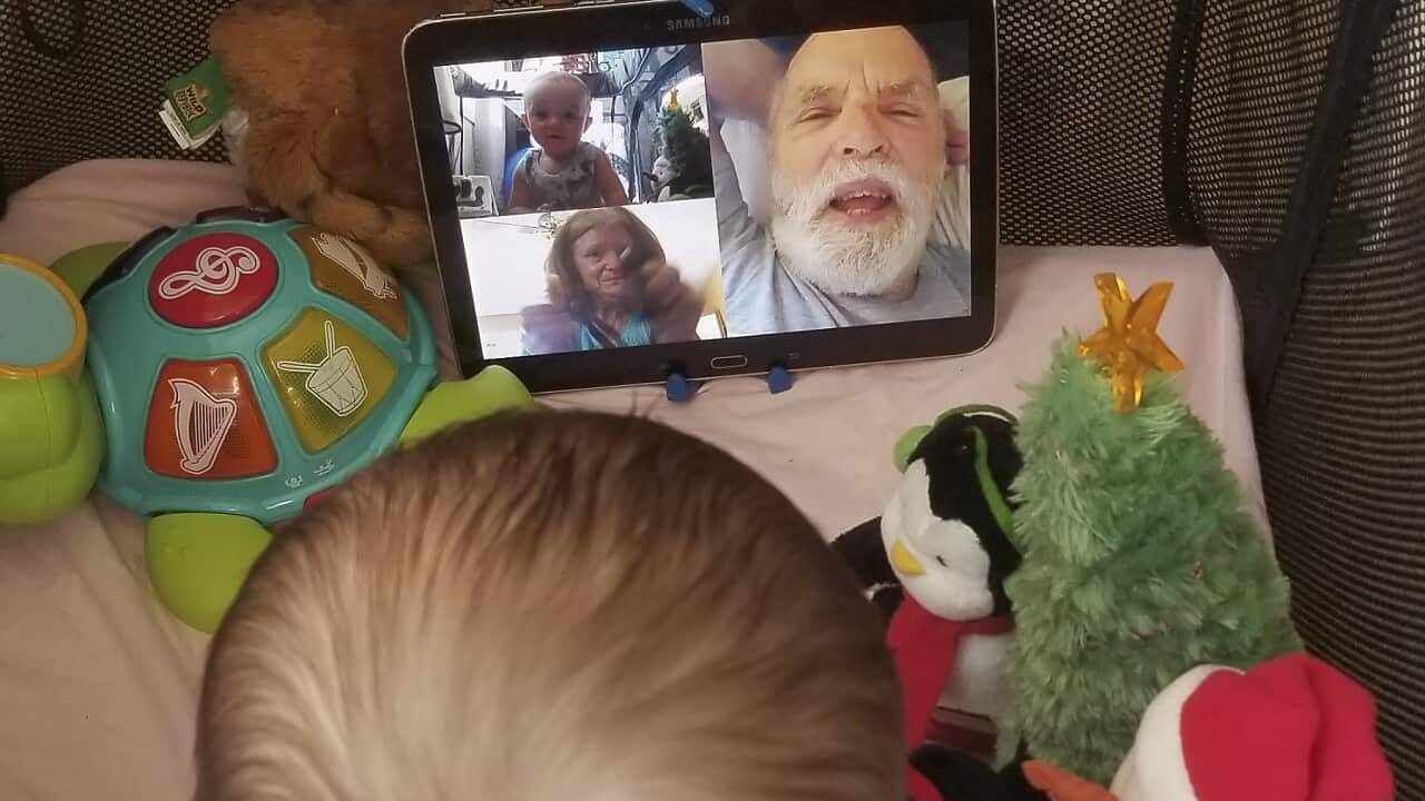 7-month-old Calvin, interacts with his grandparents on a FaceTime video call