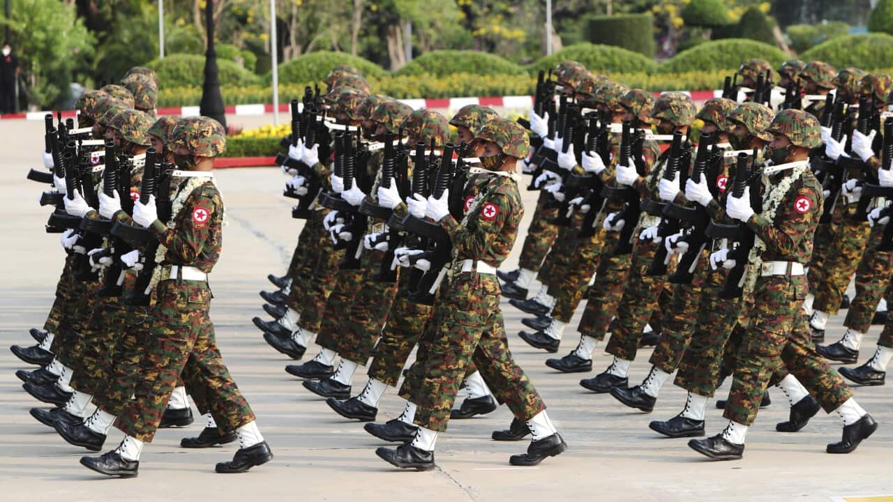 Soldiers from Maynmar's armed forces participate in a march.