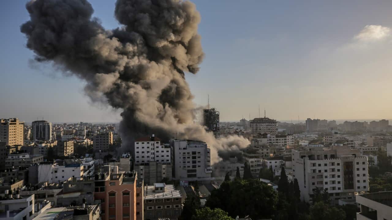 Smoke rises after an Israeli strike Al-Shorouq tower in Gaza City.