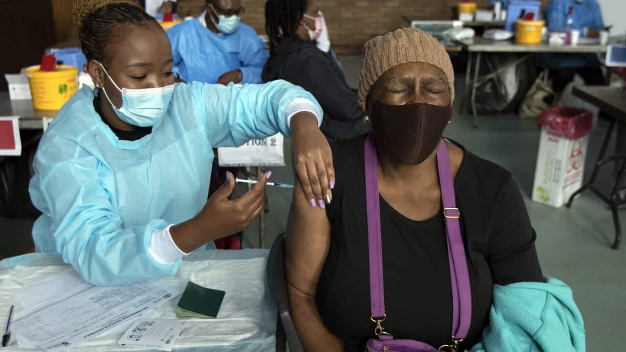 A woman receives her second vaccine jab in South Africa