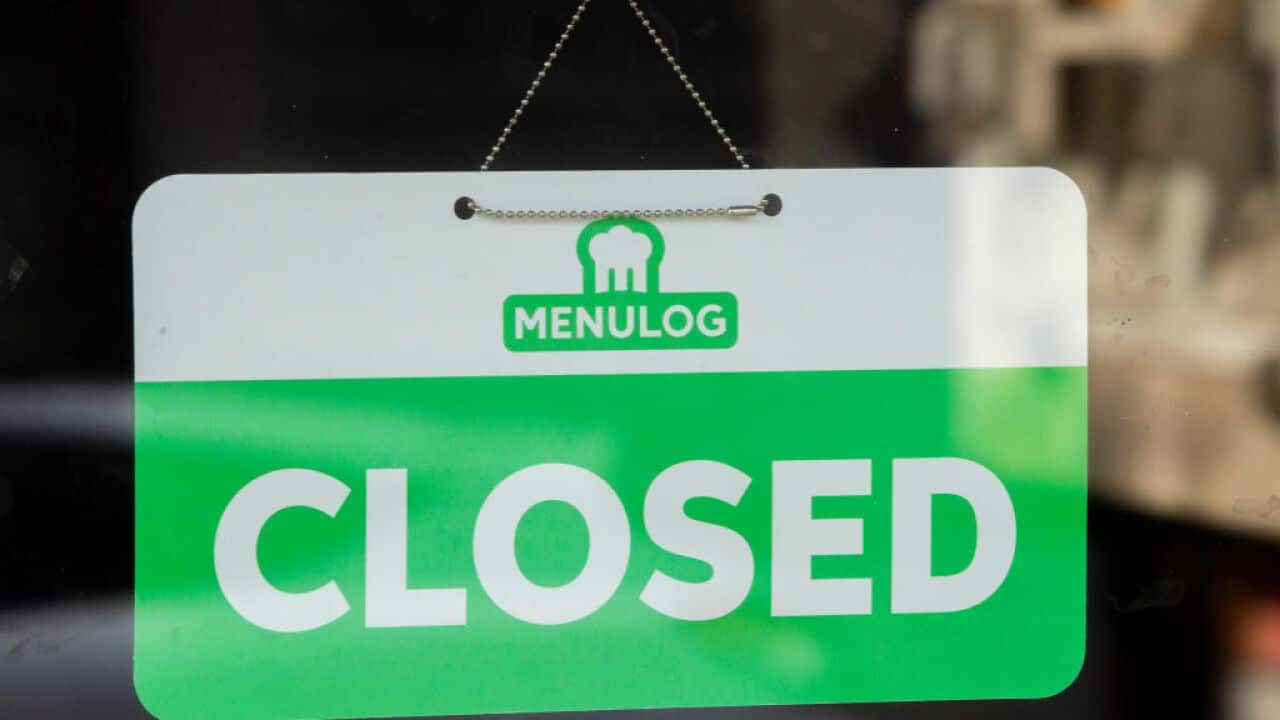 A menulog closed sign is seen in the window of a restaurant in Newtown on May 07, 2020 in Sydney, Australia