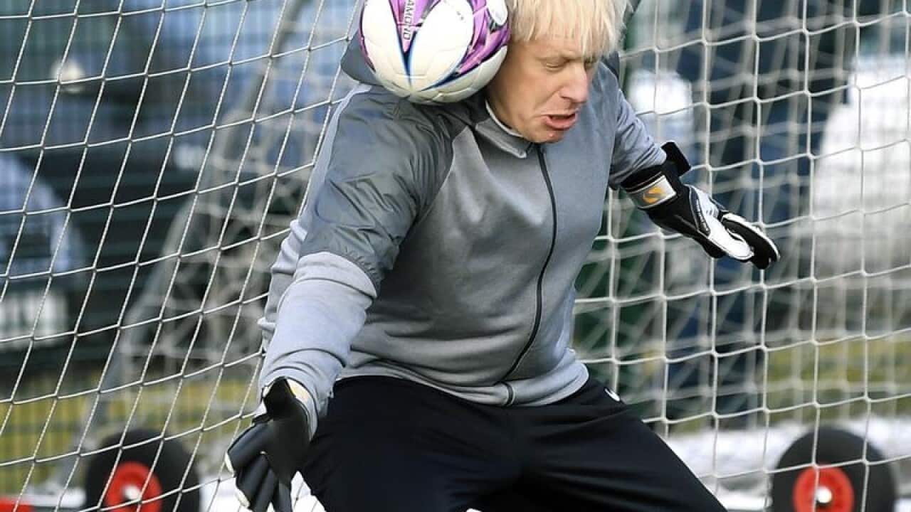 Britain's Prime Minister Boris Johnson at a girls soccer match.