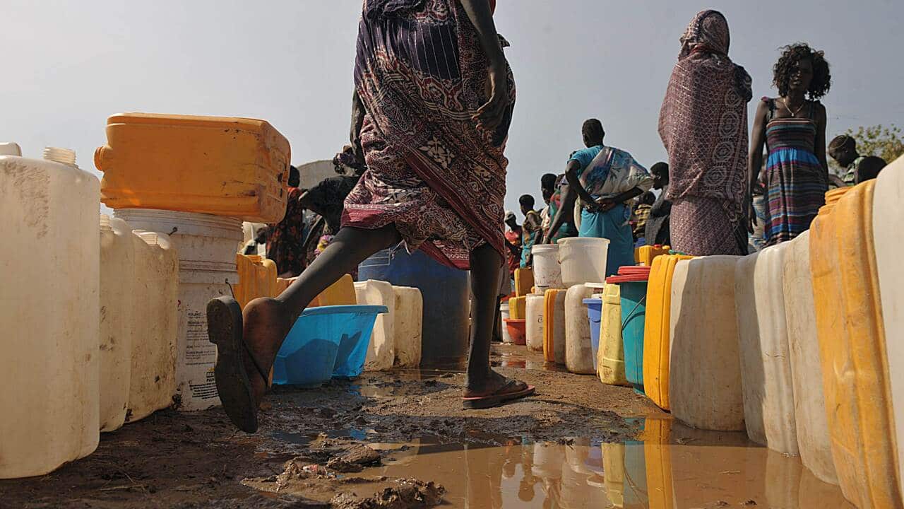 South Sudanese women queue for water - AAP-1.jpg