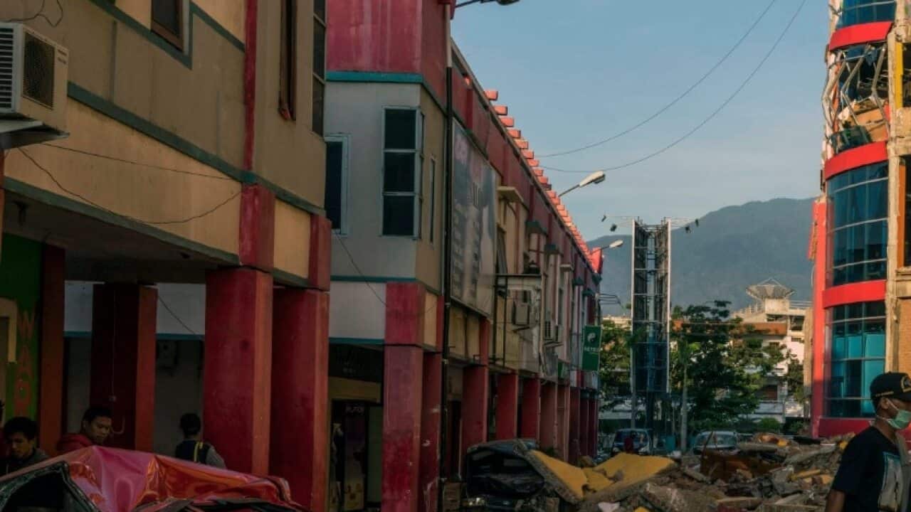Cars buried under rubble outside the damaged Ramayana Supermarket in Palu, Indonesia, on Tuesday, Oct. 2, 2018.
