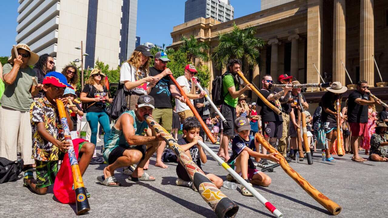 Didgeridoo flash mob mining protest