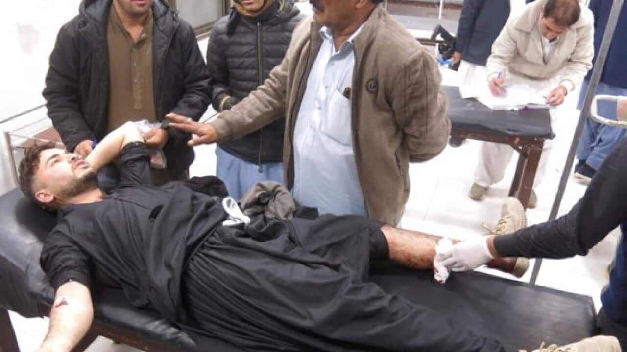 A man injured in a shooting receives medical treatment after being taken to a hospital in Quetta, the provincial capital of Balochistan.jpg