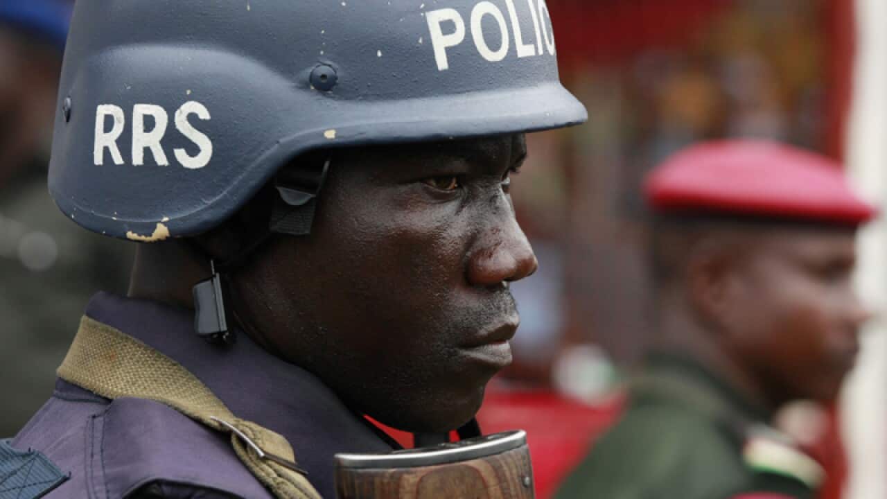 A police officer stands guard in Nigeria