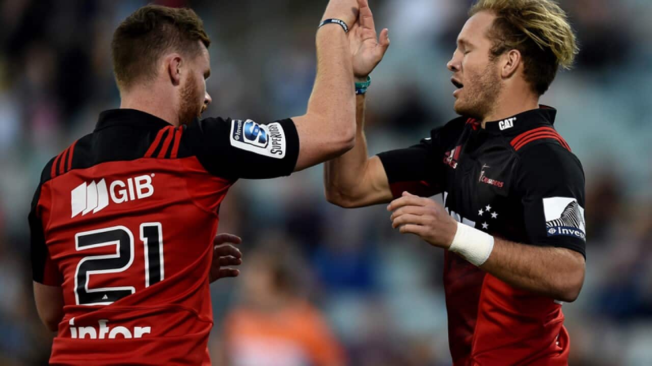 Marty McKenzie of the Crusaders (right) celebrates