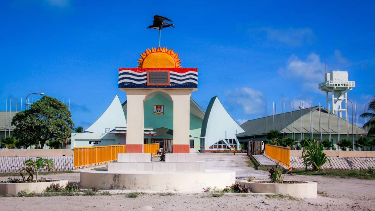 A monument outside a building.