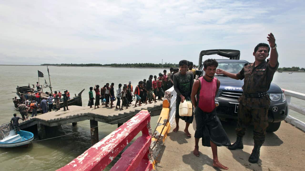 Rohingya Muslim men fleeing from ethnic strife against Rakhine Buddhists in Myanmar, are brought by Bagladeshi border guards to a boat jetty at Shahporir Dwip in Taknaf, Bangladesh, Monday, June 18, 2012. (File: AP Photo/ Saurabh Das)