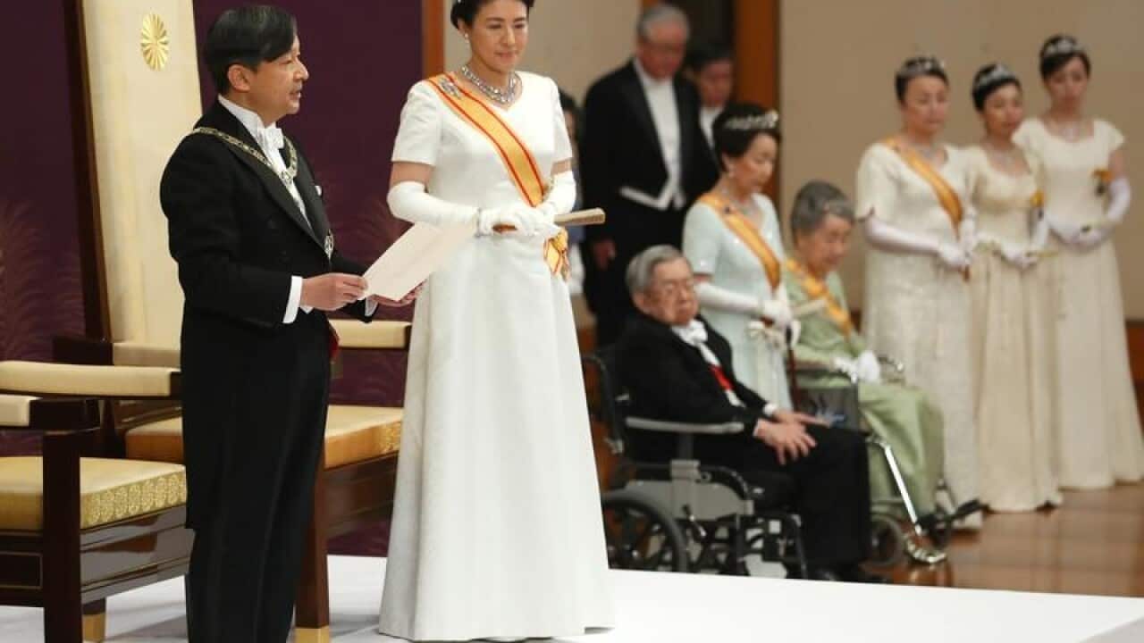 Naruhito, accompanied by new Empress Masako