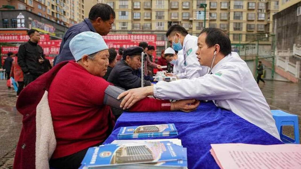 Volunteers perform a free tuberculosis clinic in Qiandongnan Miao and Dong autonomous Prefecture Southwest China's Guizhou province March 23 2023. March 24 marks the (002).jpg