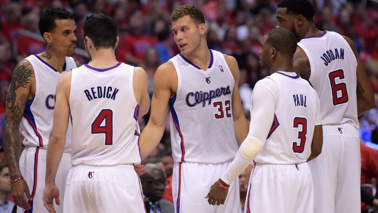Los Angeles Clippers players talk during a break