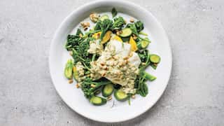 Cod with tahini, pine nuts and spinach
