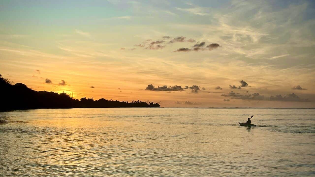 A woman kayaks in the coral lagoon surrounding Rarotonga, Cook Islands (SBS-Lucy Murray).jpg