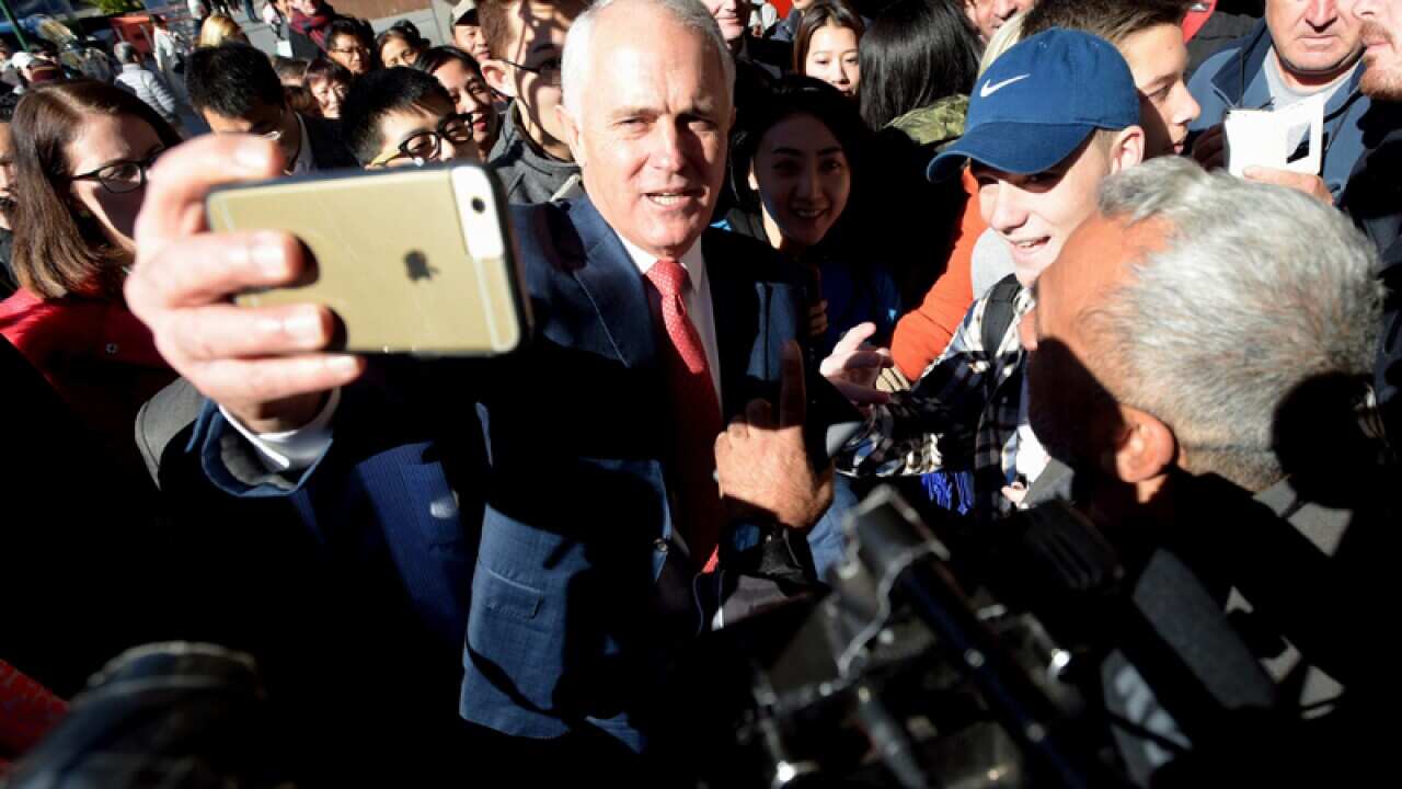 Malcolm Turnbull takes selfies with locals in Hurstville