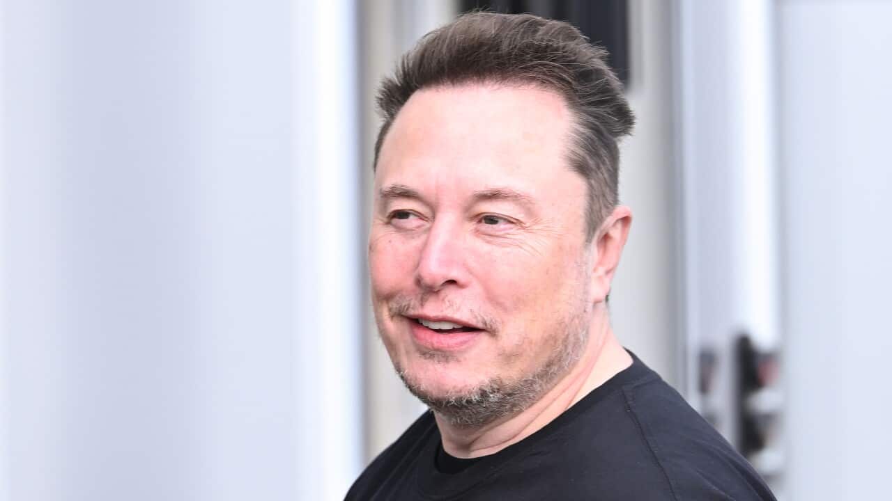 A side profile of Elon Musk in a black t-shirt.