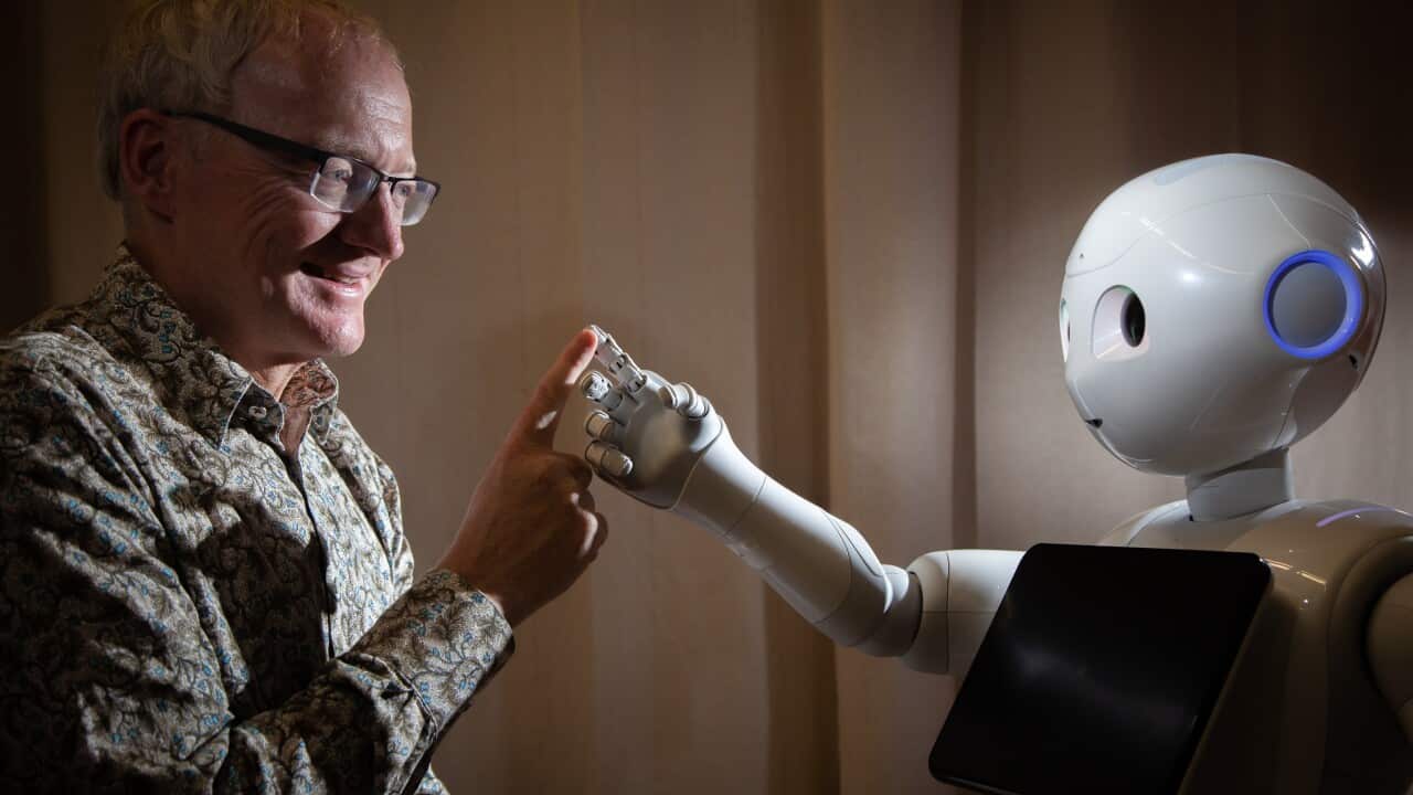 Prof.Toby Walsh with a Pepper robot