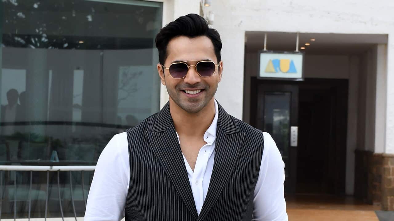Bollywood actor Varun Dhawan poses for a photo with his