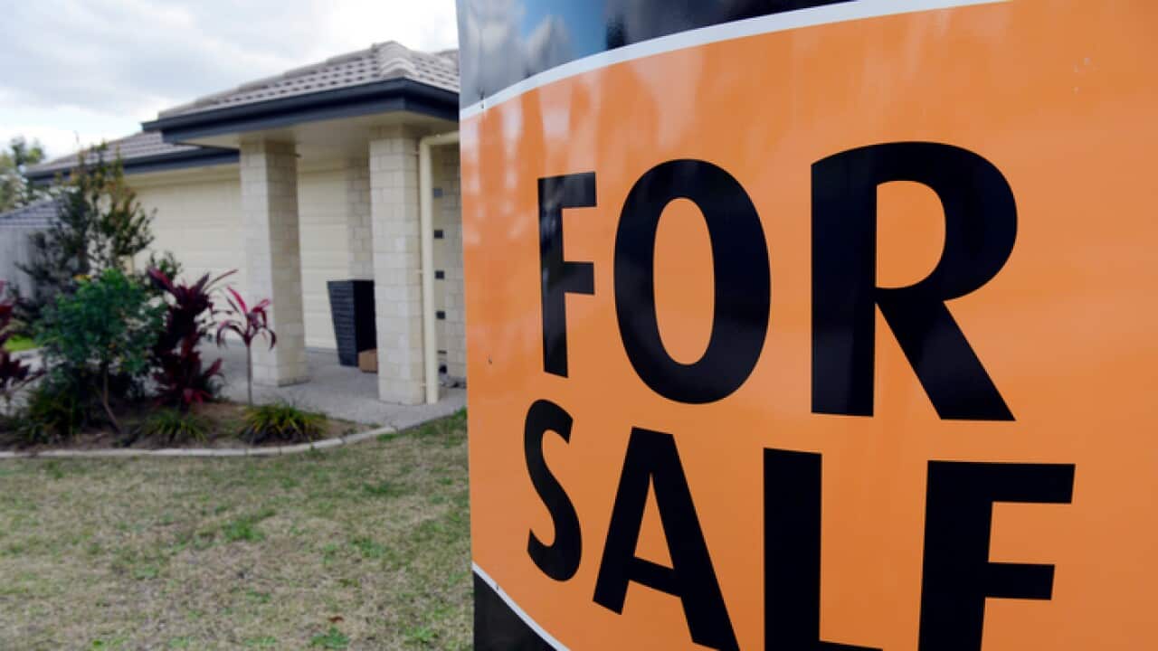 file photo of a "For Sale" sign for a home.