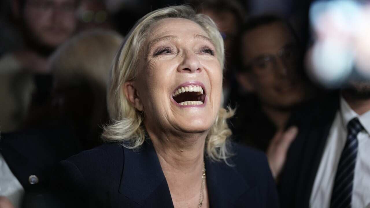 French far right leader Marine Le Pen reacts as she meets supporters and journalists after the release of projections based on the actual vote count in select constituencies , Sunday, June 30, 2024 in Henin-Beaumont, northern France.