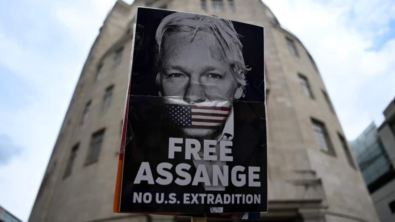 A protester demonstrates against Julian Assange's extradition to the US in central London, Britain, 18 June 2022. The UK government has announced it plans to extradite WikiLeaks founder Julian Assange to the United States. EPA/ANDY RAIN