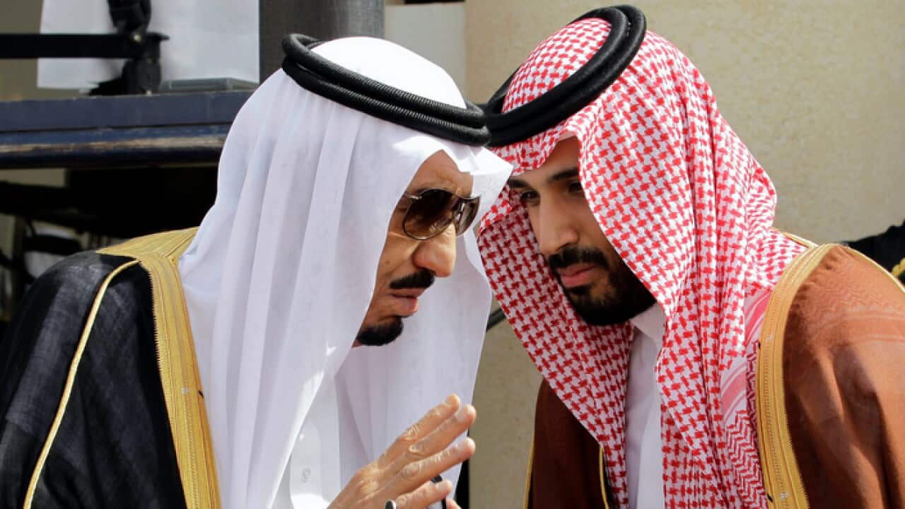 FILE - In this May 14, 2012 file photo, King Salman, left, speaks with his son, now Crown Prince Mohammed Bin Salman,