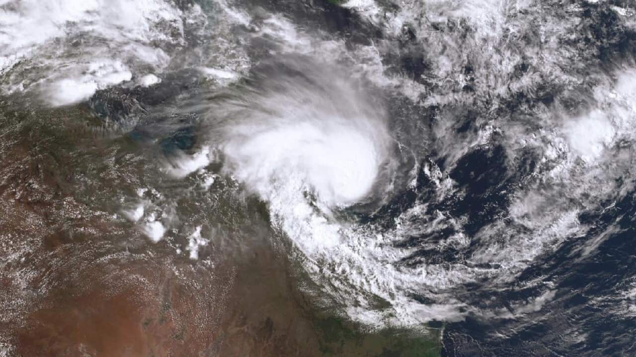 A satellite image shows a large tropical cyclone off the coast of Queensland, Australia.