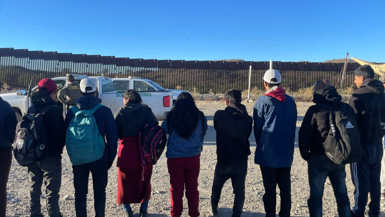 migrants waiting (SBS).jpeg