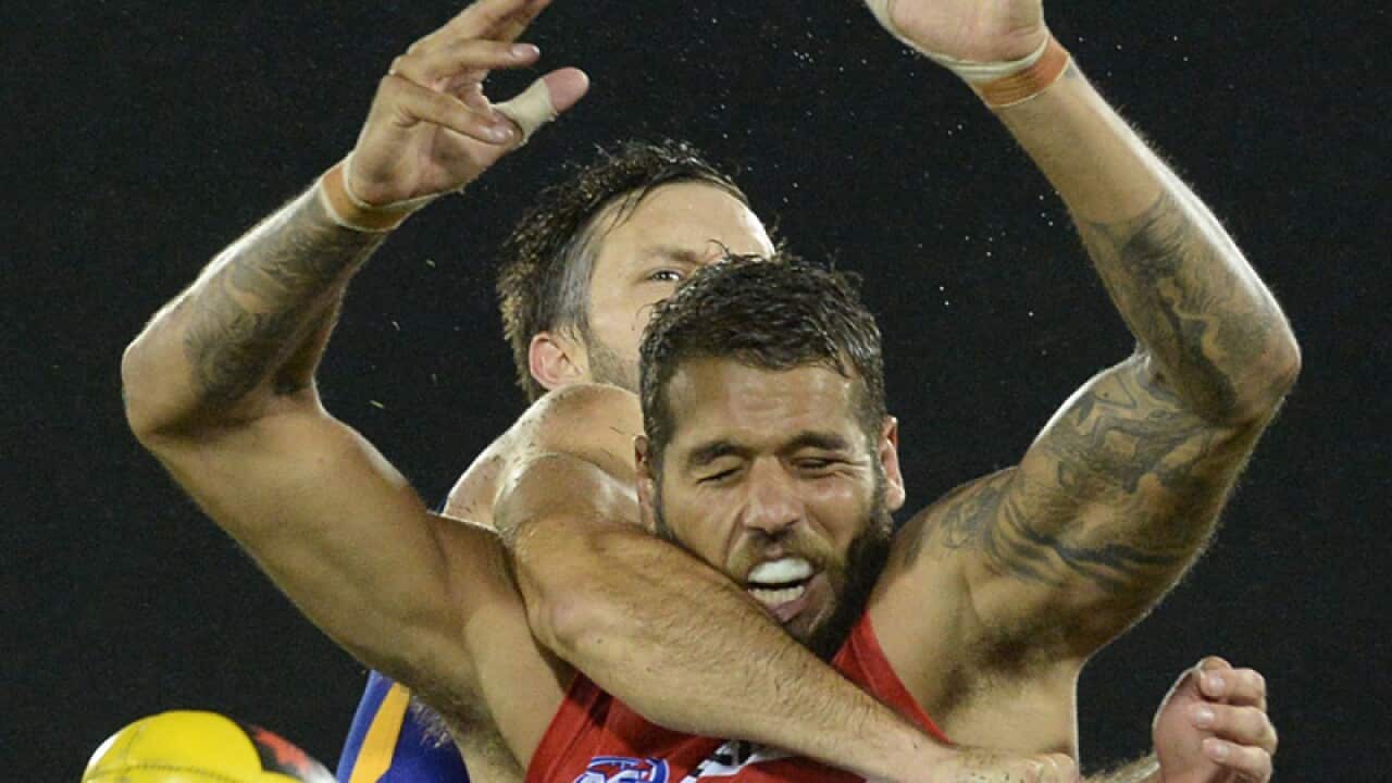 Swan's Buddy Franklin has his mark spoilt.