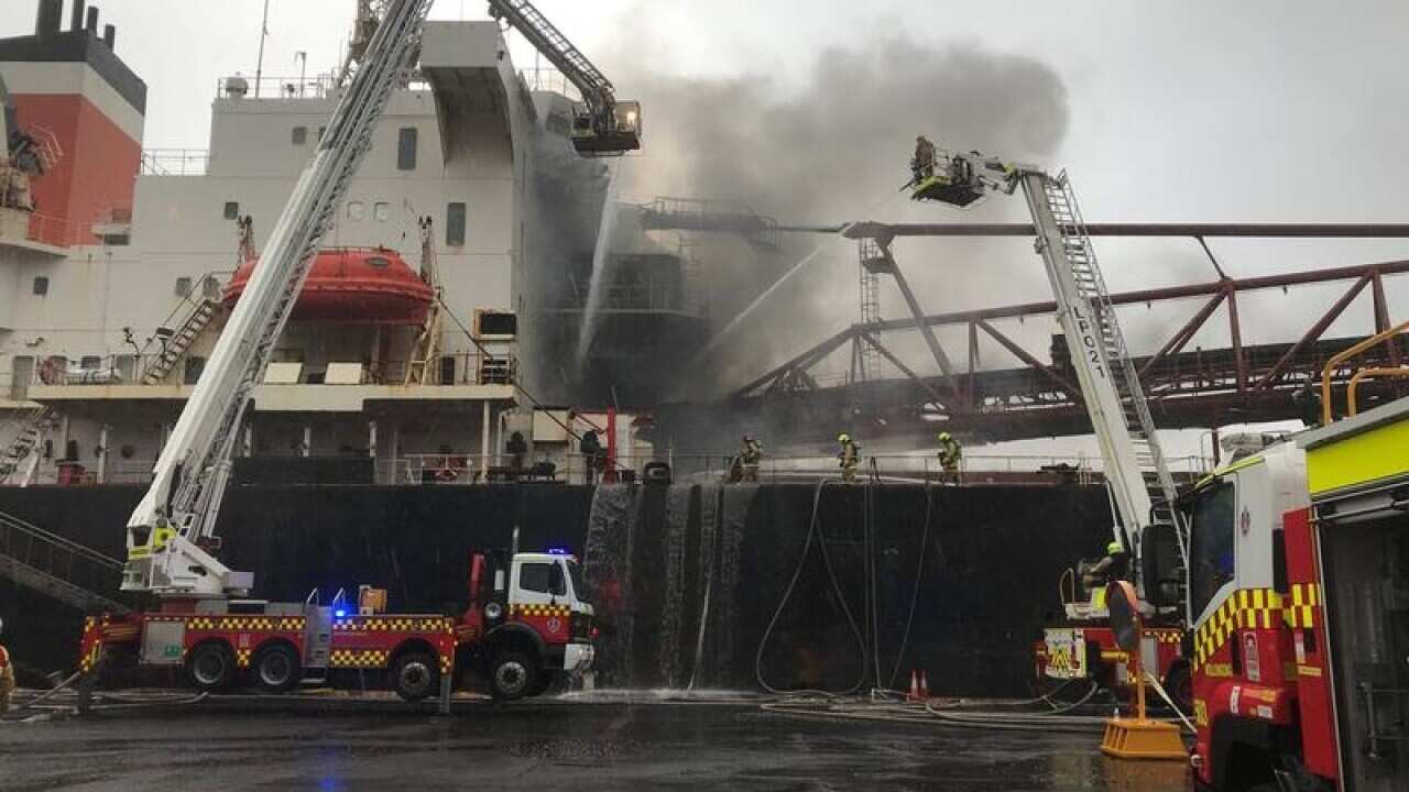 Firefighters working to contain a blaze.