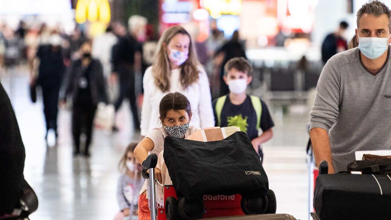 Overseas travellers arriving at the Sydney International Airport.