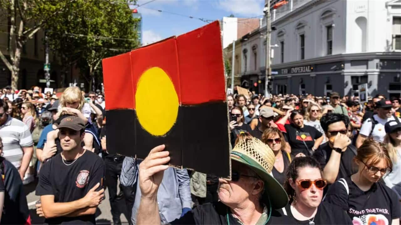 People participate at the Invasion Day rally in Melbourne.jpg