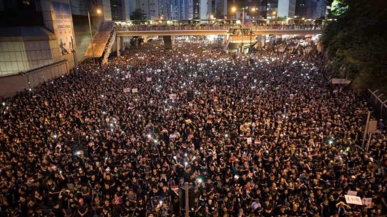 In Hong Kong, people demonstrate against a controversial extradition bill and demand the resignation of the Beijing-backed chief executive, Carrie Lam - 17 June.