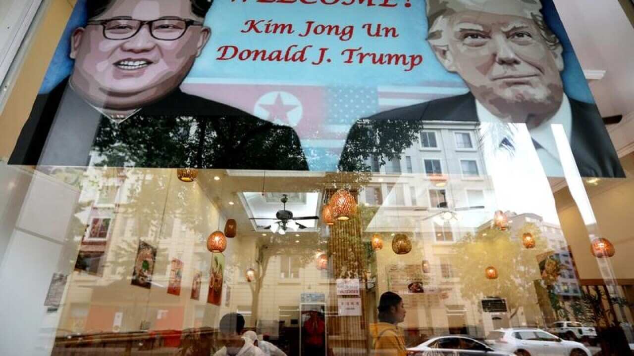 A Hanoi restaurant displays a post of the upcoming summit