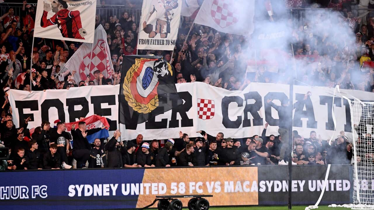 Sydney United fans display a banner at the Australia Cup final.