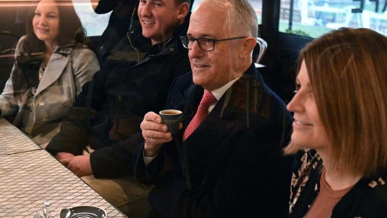 Malcolm Turnbull at a Canberra cafe to speak on income tax cuts.