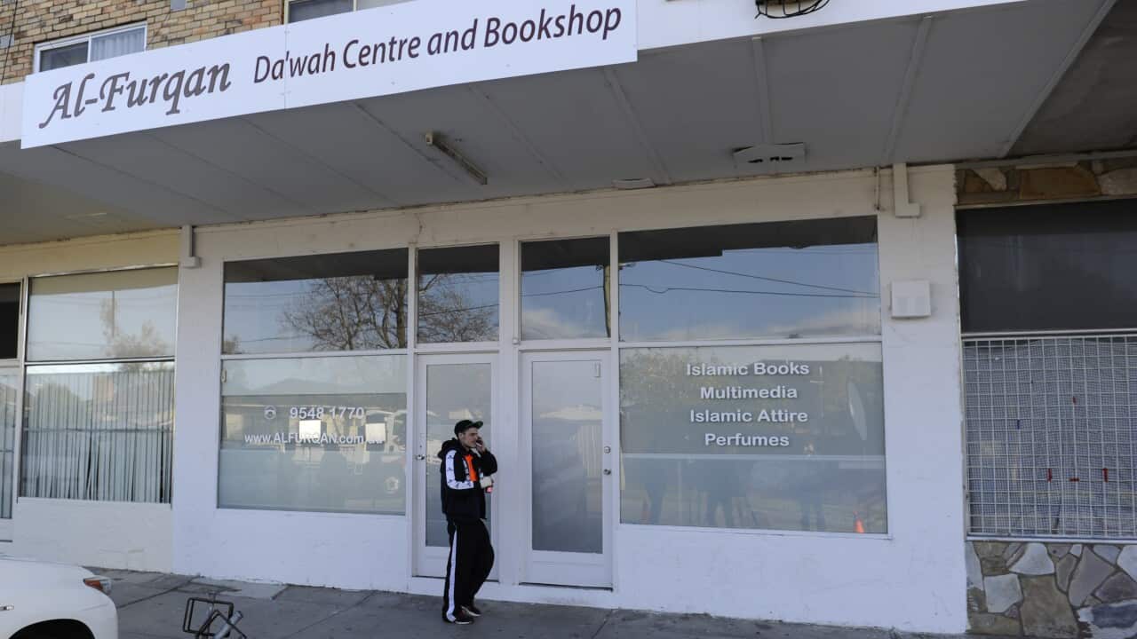 A man walks past the Al-Furqan Islamic Bookshop