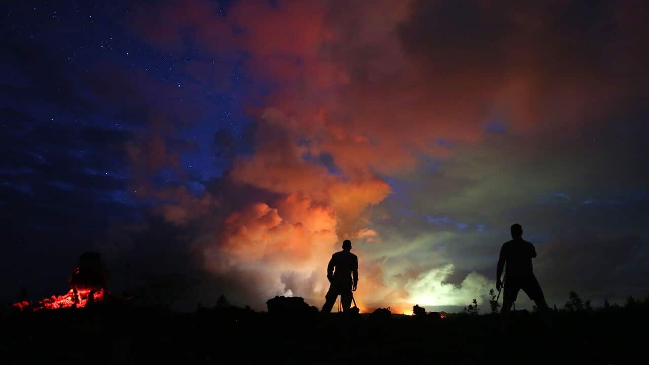 Lava from active fissures illuminates volcanic gases from the Kilauea volcano on Hawaii's Big Island.