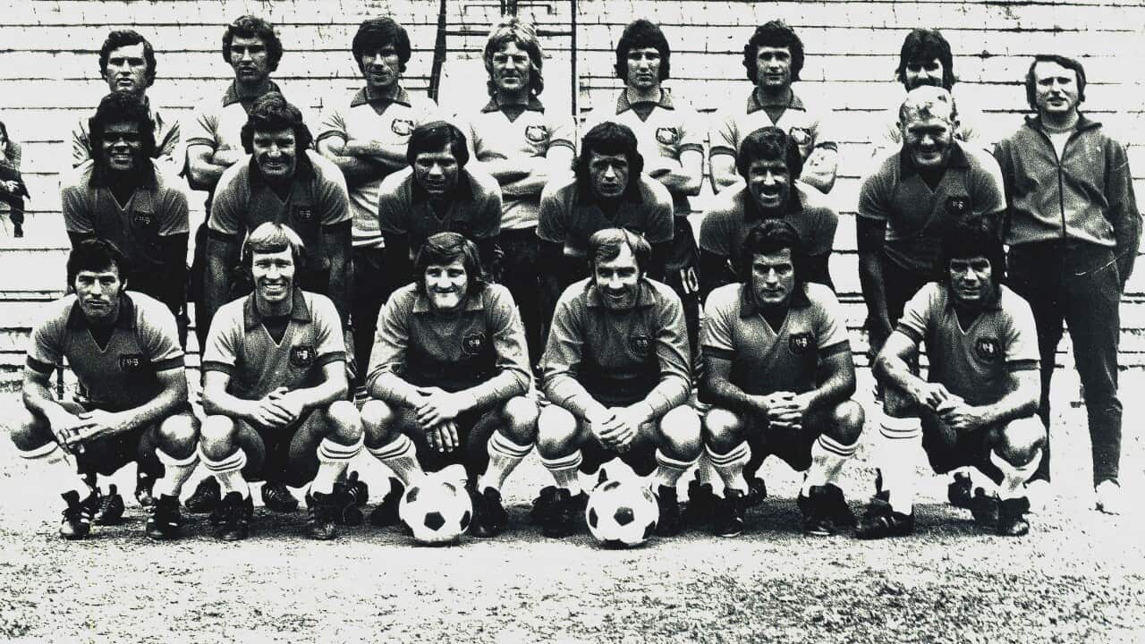 Image shows the Australian football squad, from which players will be picked to play for the Australian national football team, known as the Socceroos, in the World Cup finals. (AP Photo) Back row, from left, Z. Rasic- Coach, B. Buljevic, J. Watkiss, P. W