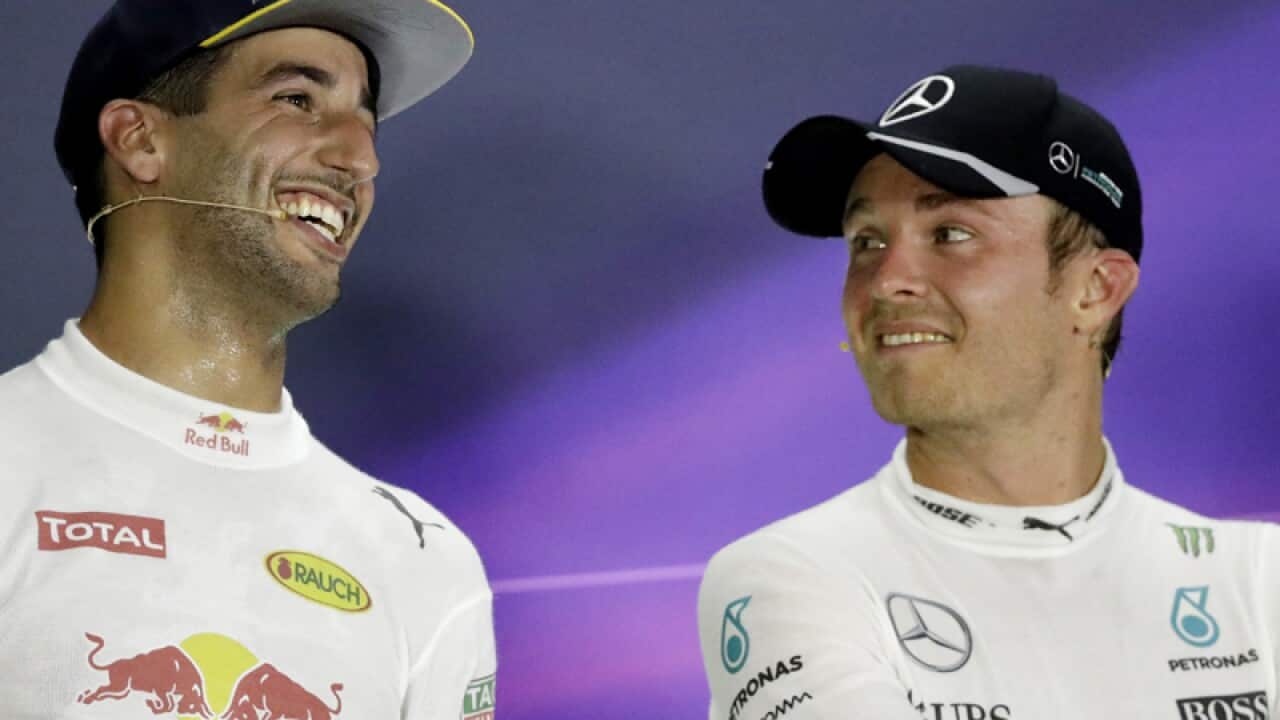 Formula One drivers Daniel Ricciardo (L) and Nico Rosberg