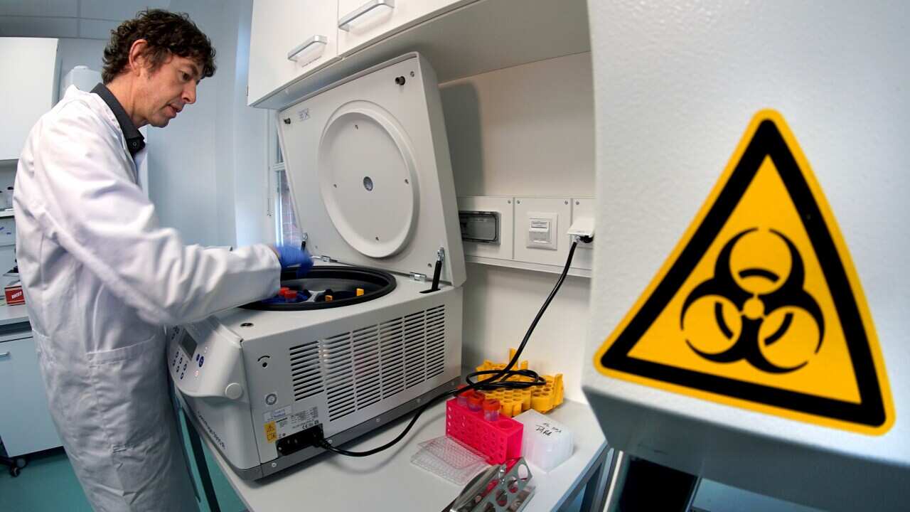 Dr. Christian Drosten working in his lab at Berlin's Charite Hospital