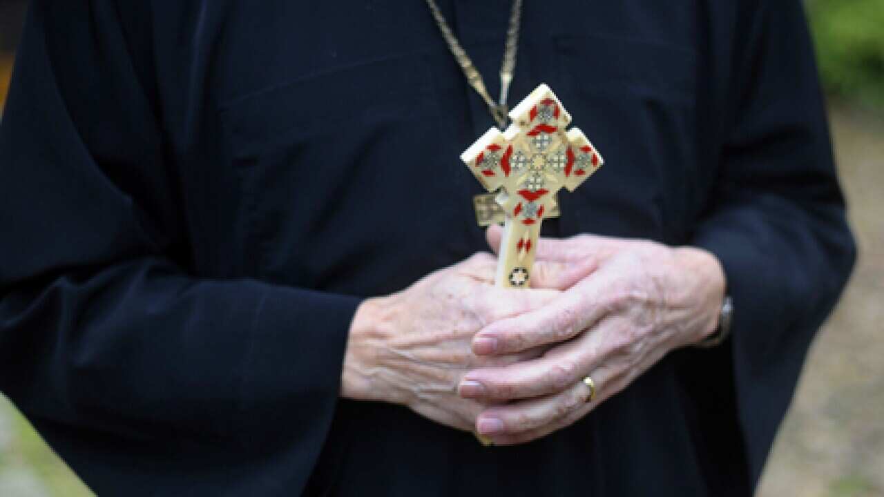 coptic_priest_cross_110107_B_getty_1017744156