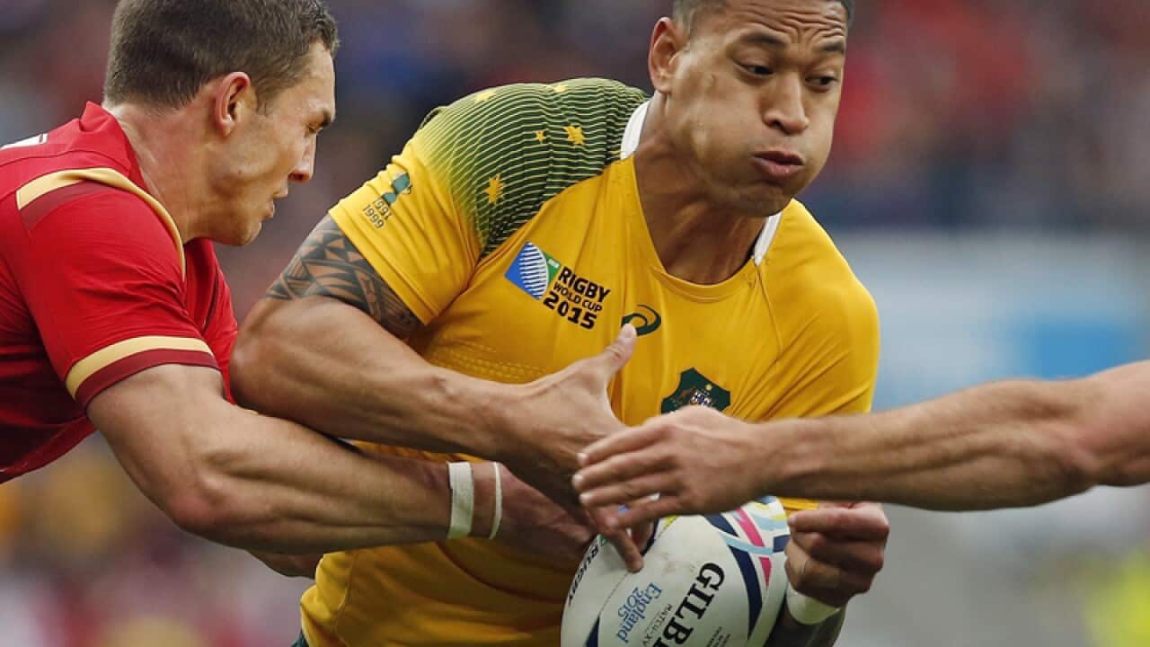 Australia's Israel Folau is tackled by Wales' George North