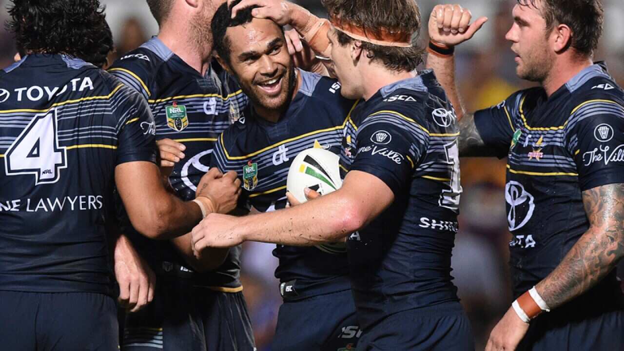 Justin O'Neill of the Cowboys (centre) celebrates