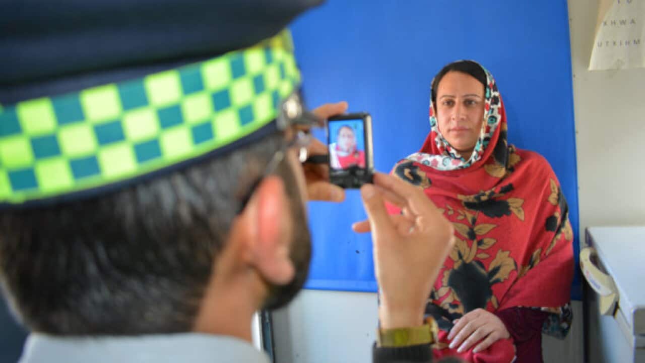 Transgender takes photo for driving licence