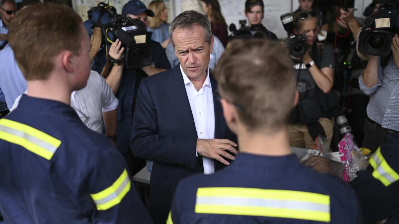Australian Opposition Leader Bill Shorten speaks to workers at a barbecue event during a visit to Gladstone Ports in Gladstone, Tuesday, April 23, 2019. (AAP Image/Lukas Coch) NO ARCHIVING