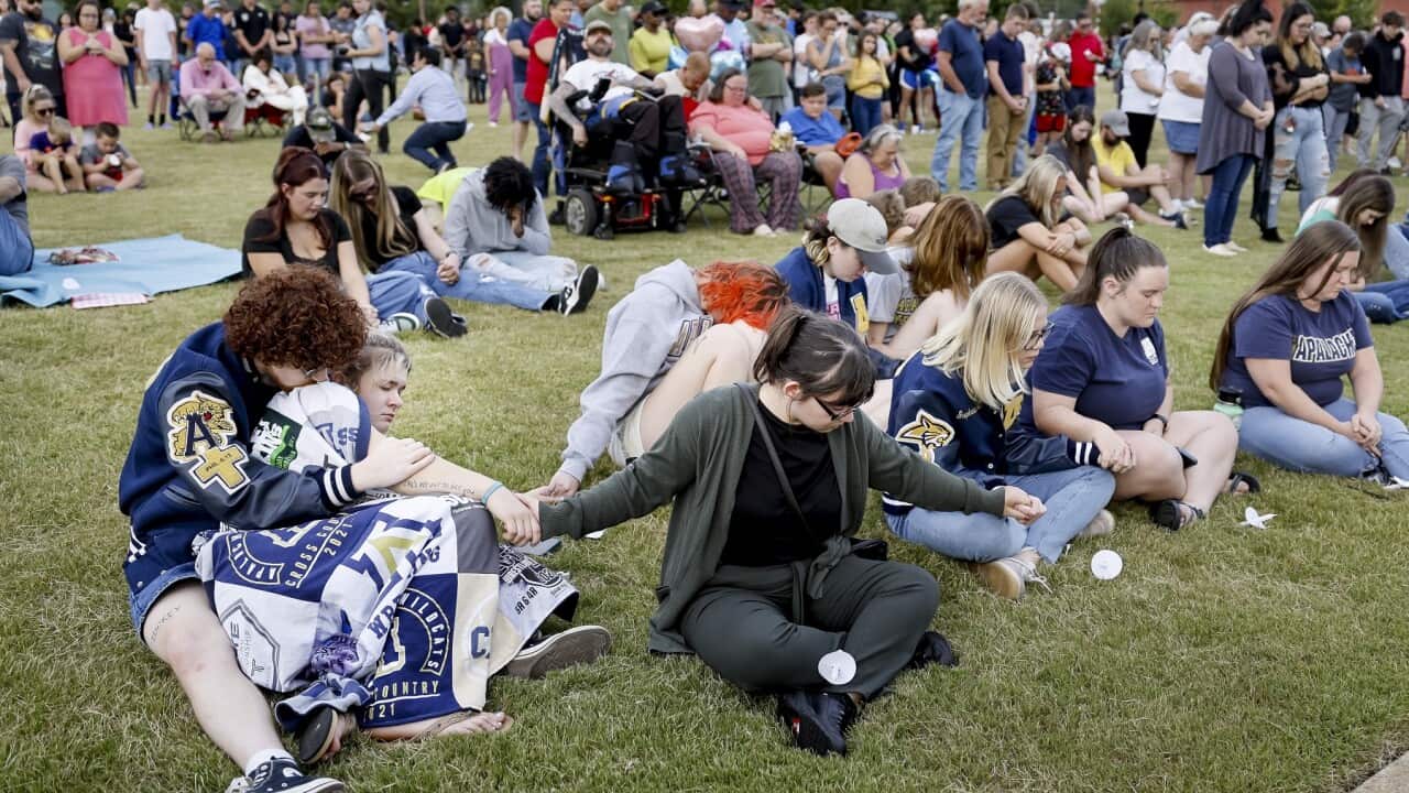 People gather for a vigil for the victims of a school shooting at Apalachee High School in Winder, Georgia (AAP)