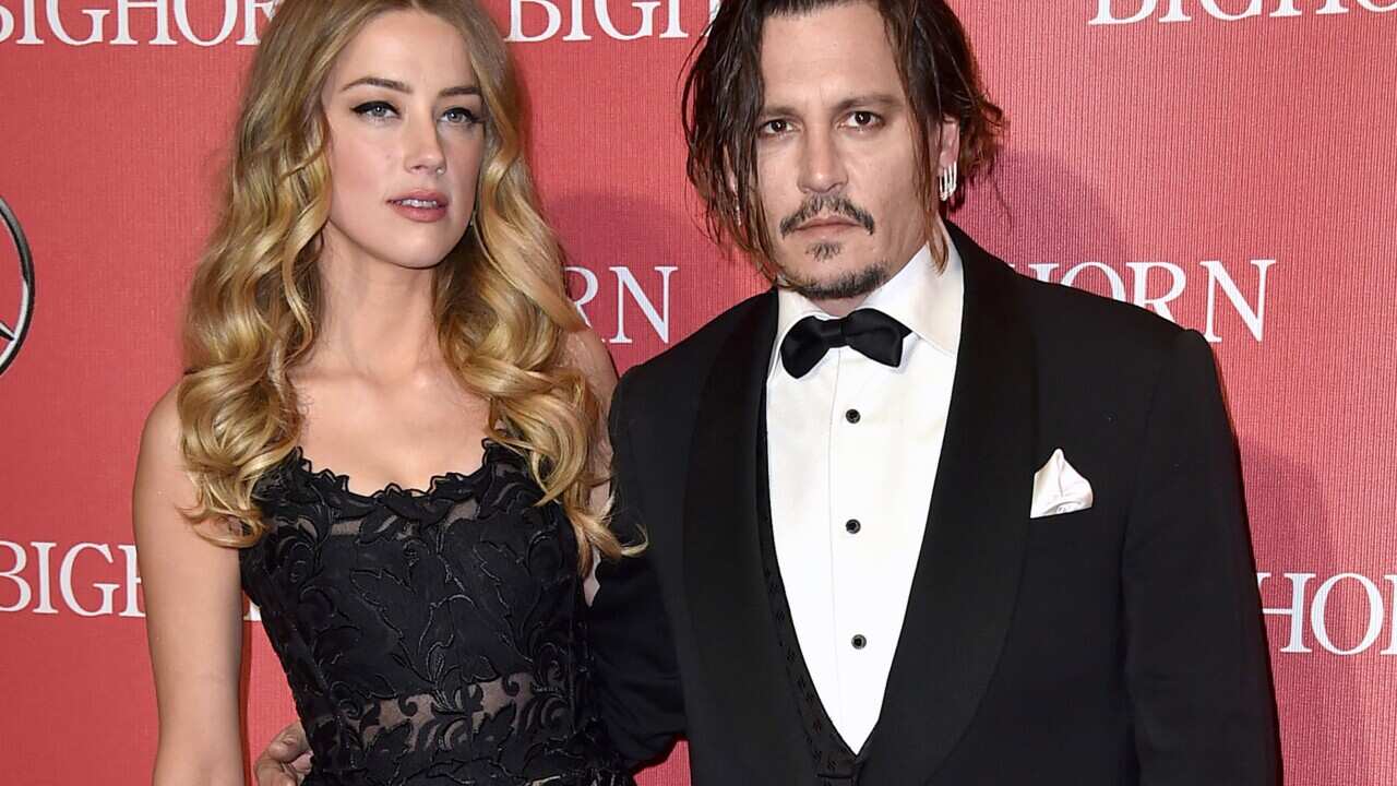 File image of Amber Heard, left, and Johnny Depp