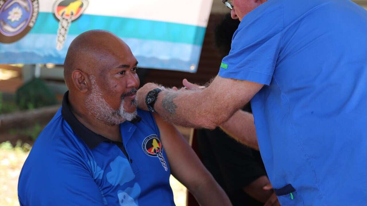 Senior Aboriginal Practitioner at WA's Beagle Bay clinic, Vaughan Matsumoto receives a coronavirus vaccine